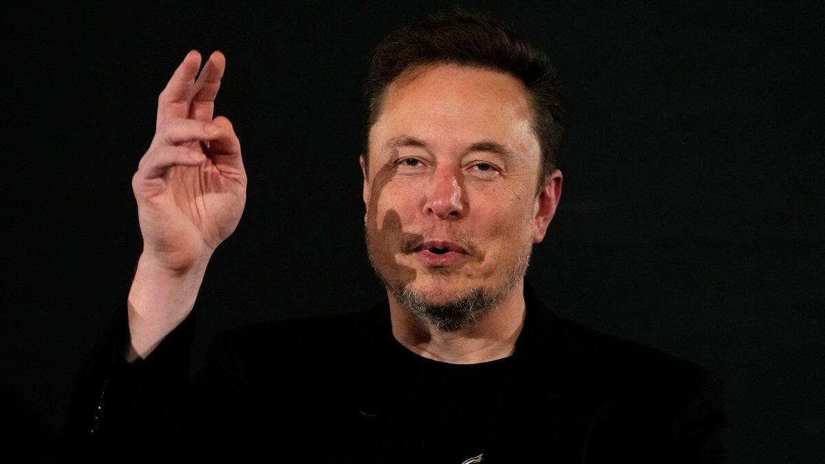 File - Elon Musk, owner of social media platform X, gestures during an event with Britain's...