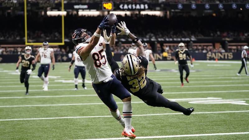 Chicago Bears tight end Cole Kmet (85) makes a touchdown catch over Saints safety Tyrann...