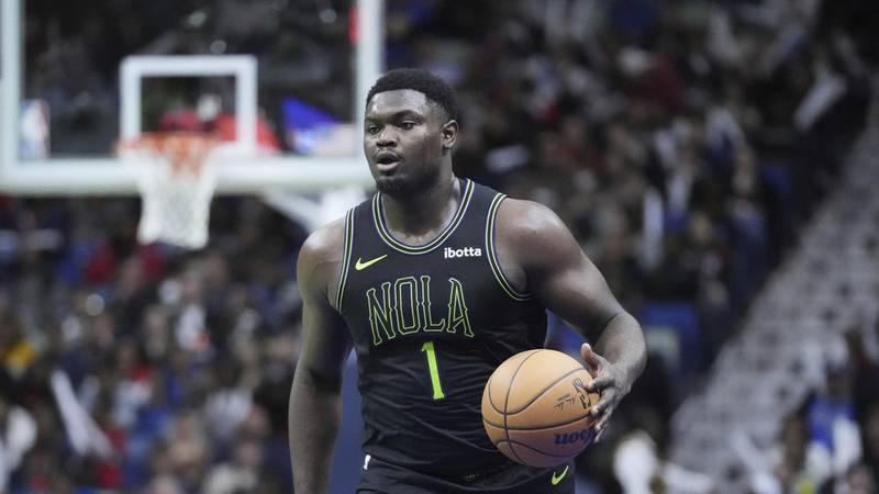 New Orleans Pelicans forward Zion Williamson (1) moves the ball down court in the first half of...