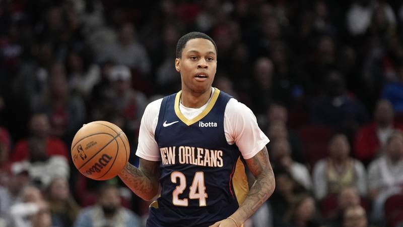 New Orleans Pelicans guard Jordan Hawkins (24) dribbles during the second half of an NBA...