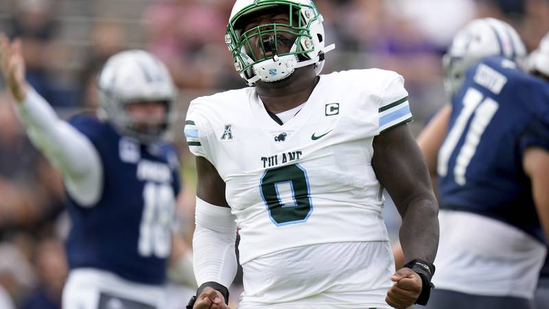 Tulane defensive lineman Patrick Jenkins reacts after a first-half tackle against Rice on...