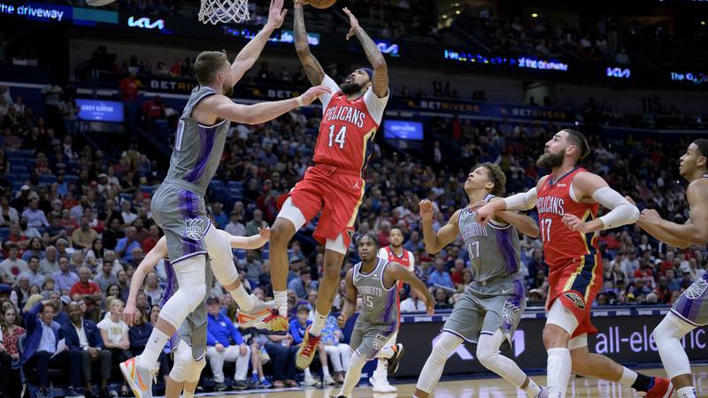 Pelicans forward Brandon Ingram (14) shoots against Sacramento Kings forward Domantas Sabonis,...